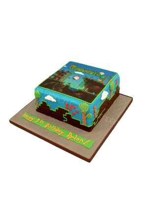 Gâteau d'anniversaire carré personnalisé sur le thème du jeu vidéo Terraria décoré de murs de briques en pâte à sucre, d'arbres pixélisés, de cœurs rouges et d'une impression comestible du jeu, créé par The French Cake Company.