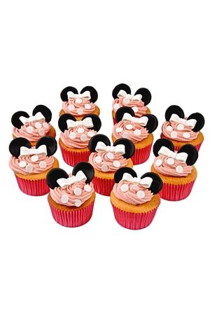 A group of cupcakes with pink swirled frosting, decorated with white edible dots and handcrafted black Minnie Mouse ears with white bows.