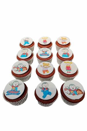 Douze cupcakes décorés avec des impressions alimentaires de T'choupi et ses amis.