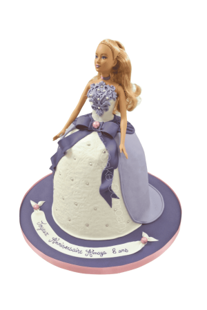Blonde Barbie doll cake featuring a textured white dress with pearl accents, purple cape overlay, large purple bow at the waist, and lace bodice detailing on a purple board by The French Cake Company