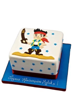 A square white fondant birthday cake decorated with scattered blue sugar stars, featuring a large flat-lay sugar illustration of Jake the Pirate holding a brown sword with the number two on it.