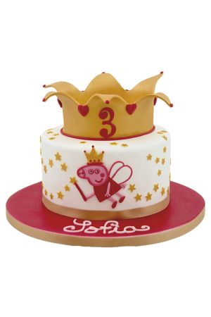 Gâteau d'anniversaire blanc étoilé de doré avec motif de Peppa Pig en fée avec ailes et baguette magique, couronné d'une grande tiare royale dorée réalisé par The French Cake Company