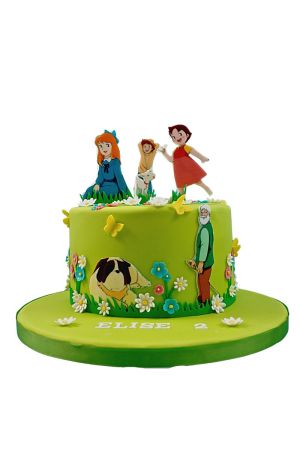 Appelgroene Heidi verjaardagstaart gedecoreerd met witte madeliefjes, gele vlinders, opa, hond Josef en toppers van Heidi, Clara en Peter gemaak door The French Cake Company