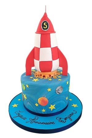 3D red and white checkered space ship rocket launching off a marbled blue planet birthday cake decorated with yellow stars
