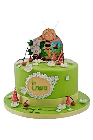 A whimsical birthday cake decorated with a vibrant pink and black Maya the Bee design, complete with edible flowers.
