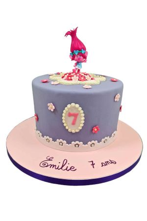 Purple Trolls birthday cake with Princess Poppy topper and small flowers handcrafted by The French Cake Company