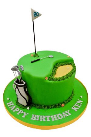 Customized green golf course birthday cake with sand bunker, golf clubs, and flag pin by The French Cake Company