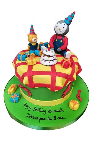 Pique-nique d'anniversaire de Tchoupi et ses amis sur un gâteau décoré