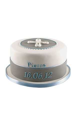 A single-tier white and grey communion cake with a minimalist white cross on a grey oval on top and blue trim details.