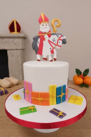 Decorated Saint Nicholas cake, featuring edible Saint Nicholas figure on horseback, by The French Cake Company.