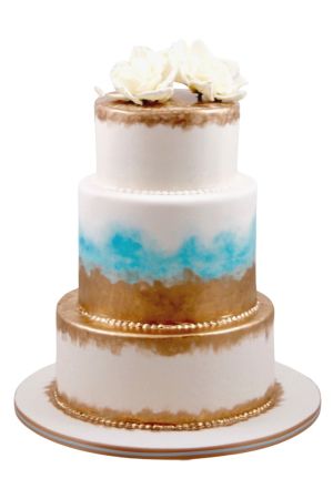 Gouden en blauwe bruidstaart