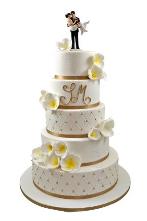 Gold and exotic flower wedding cake